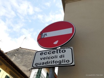 A "Do Not Enter" sign with decals by Clet Abraham (Florence)